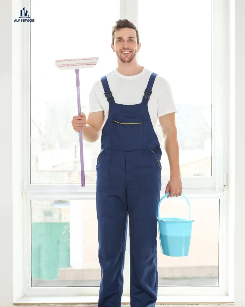 Professional domestic cleaner in Chiswick holding mop and bucket