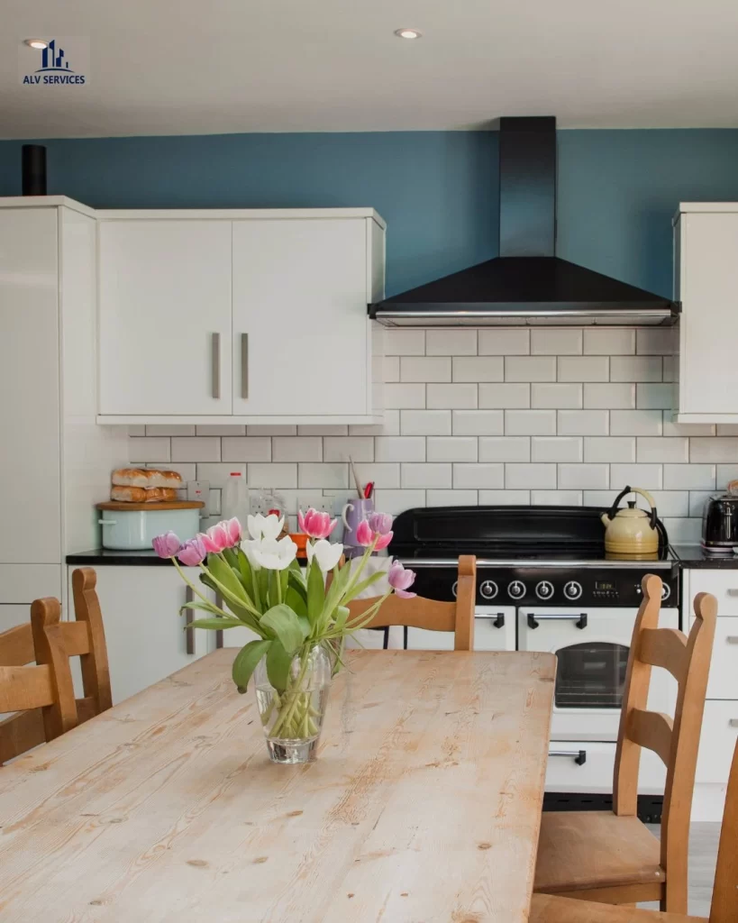 Professionally cleaned kitchen in Chiswick with wooden table and modern oven